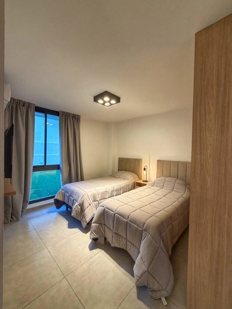 Bior 4, Villa Carlos Paz: dormitorio con dos camas